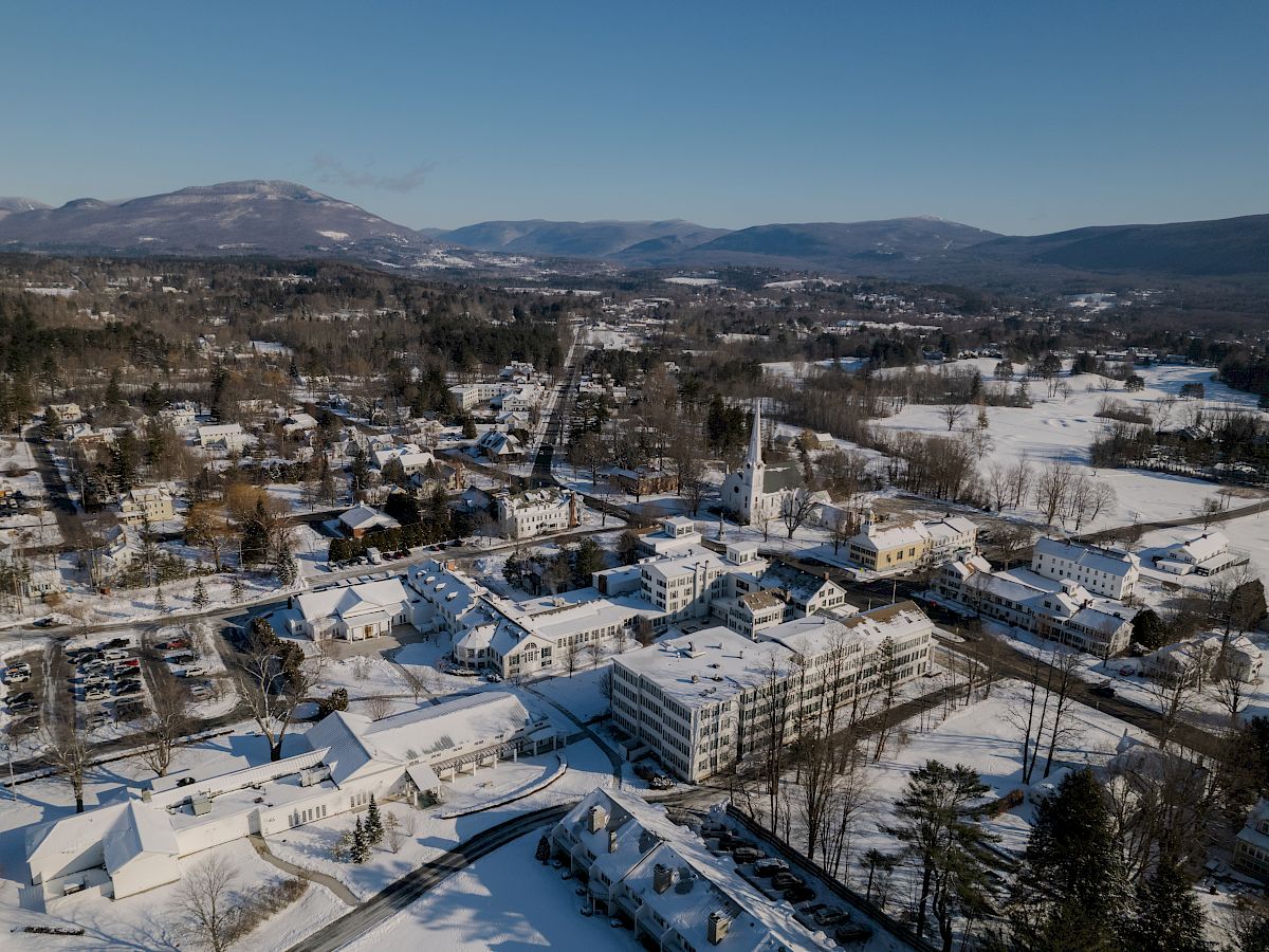 Image of snowy Manchester, Vermont. Ariel view of buildings and snowy landscaping.