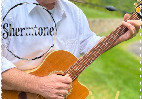 A person is playing a guitar outdoors, with 